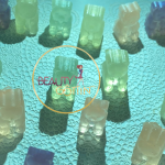 Gummibärchen-Form aus Transparentseife in weiß, grün, gelb und dunkelblau